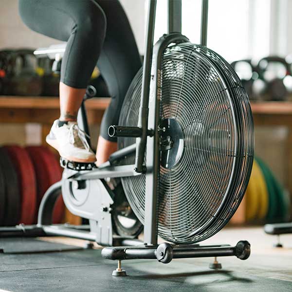 Woman exercising on warm up bike
