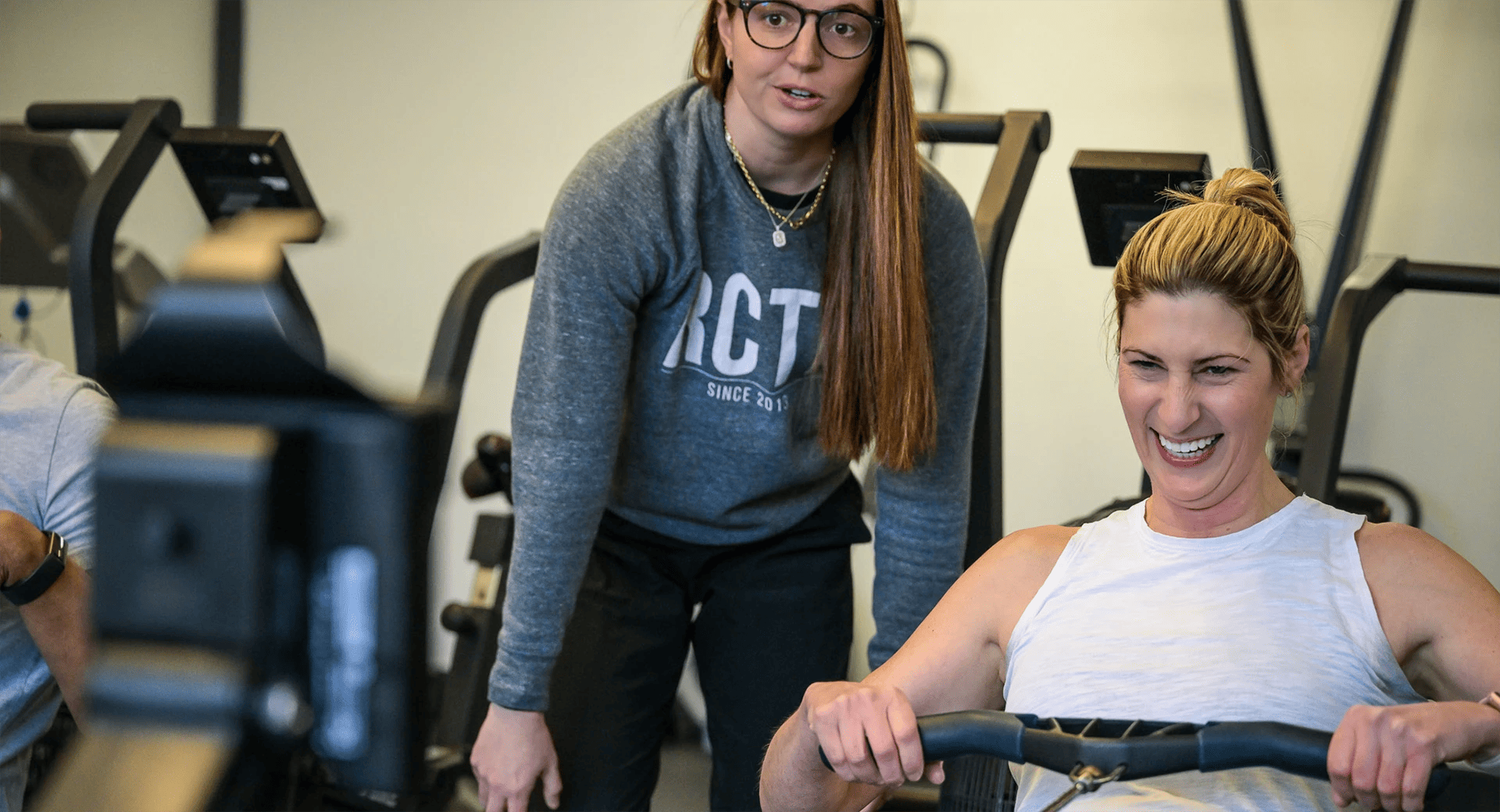 Woman training with her personal trainer at RC Training & Fitness
